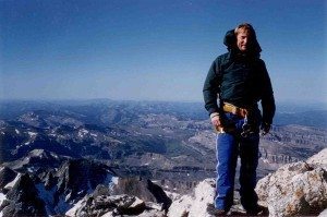 author Larry Kelley at the top of tetons