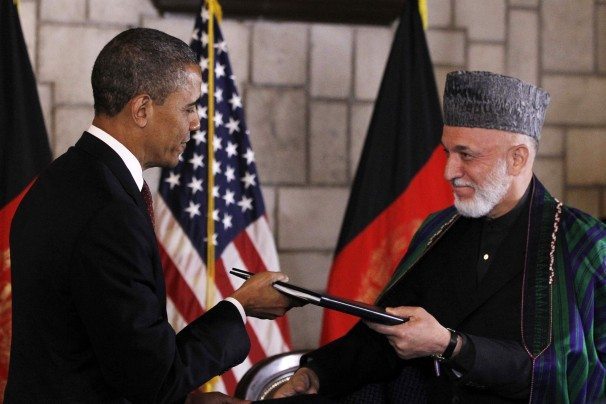 President Obama and Afghan President Hamid Karzai arrive to sign a strategic partnership agreement at the presidential palace in Kabul.—ImgSrc: http://goo.gl/21dVw
